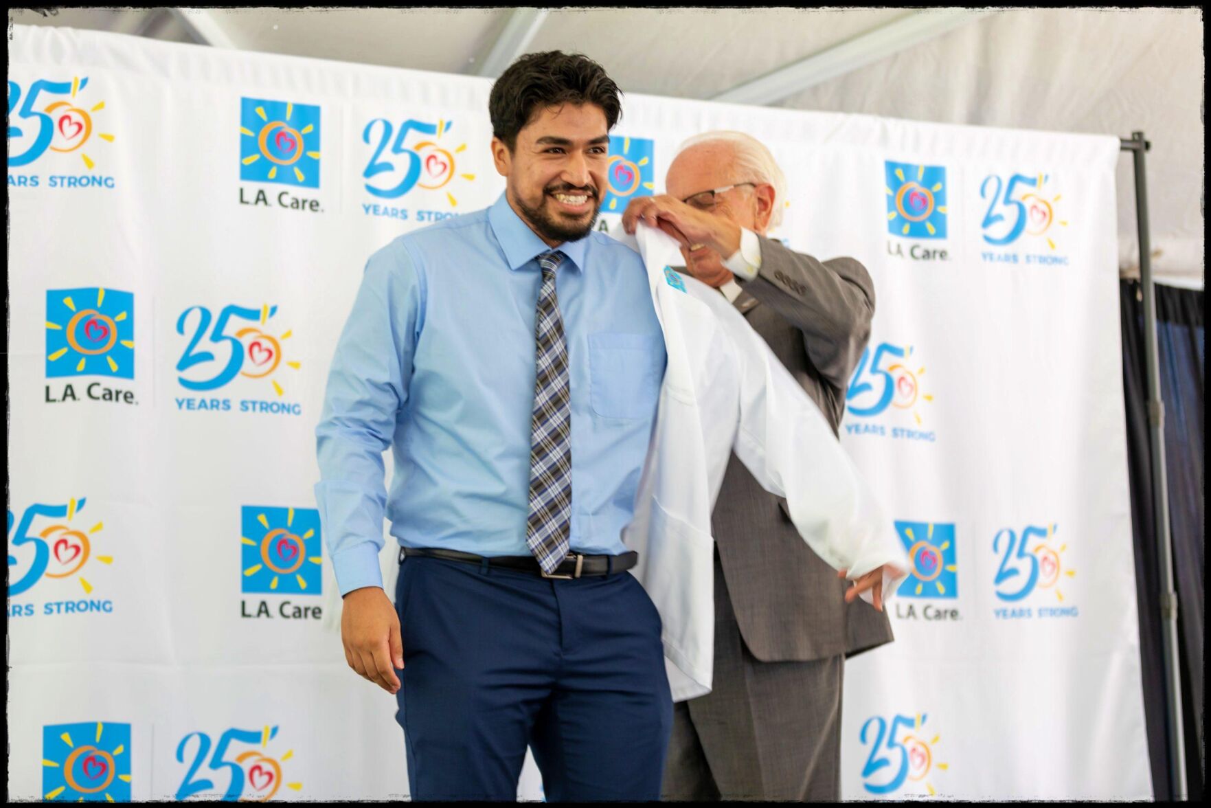 Getting L.A. Care White Coat from L.A. Care CEO John Baackes